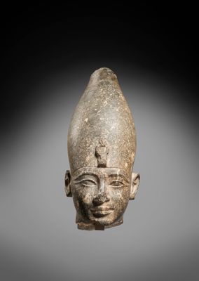 an egyptian head of a man with a hat on his head