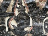 a close up of a piece of art on a wall