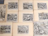 several old books with drawings on them sitting on a table