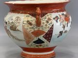 a large vase with a design on it on a table