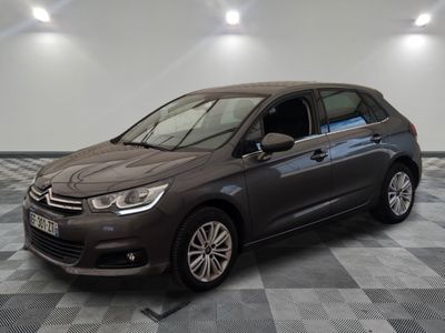 the grey citrole is parked on a checkered tile floor
