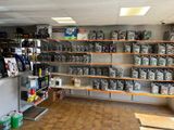 a room with a lot of different items on the shelves