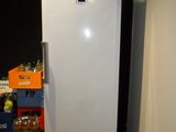 an image of a refrigerator in the corner of a room