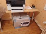 a printer that is sitting on top of a desk