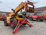 a picture of a red and yellow forklift in a parking lot