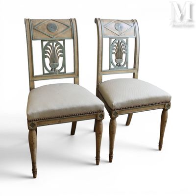 pair of chairs with upholstered back and upholstered seat