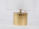 brass and glass table lamp with a clear glass dome on top