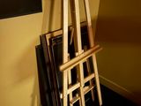 a wooden easer that is leaning against a wall