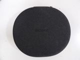 a black round object on a white surface