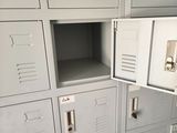 many lockers in a room with many doors open
