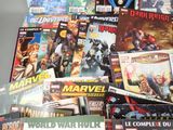 a lot of comic books sitting on a table