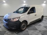 a white van is parked in a room with checkered flooring