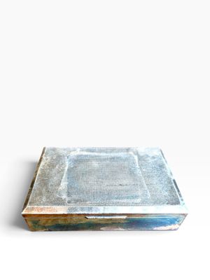 an image of a metal tray with a metal lid on a white surface