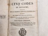 an open book with a picture of a crown on top of it