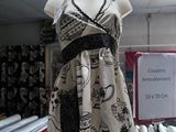 a mannequin with a dress on display in a store