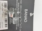 a black box with a label on it sitting on a white surface