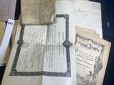 many old papers that are on a table