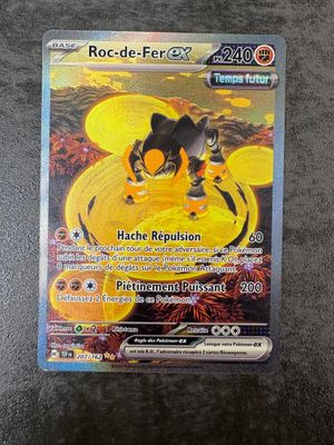 a close up of a pokemon card on a table
