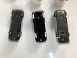 four different types of cell phones sitting on a table