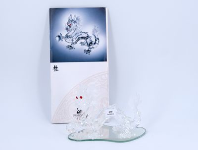 a picture of a pair of crystal shoes on a white surface