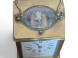 a small clock that is sitting on a table