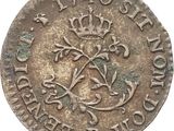 a close up of a coin with a crown on it