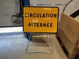 a yellow and black sign that says circulation alert