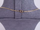 a close up of a mannequin with a gold chain on it
