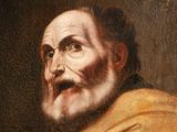 an old painting of a man with a beard and a yellow robe