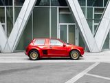 a red car that is parked in front of a building