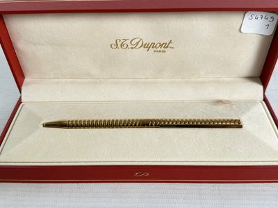 a pen that is in a red box on a table