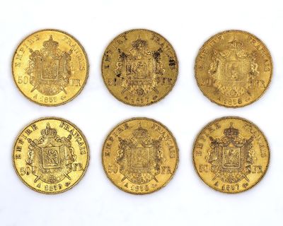 six different types of gold coins on a white surface