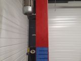 a picture of a red and blue pole in a garage