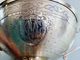 a silver trophy that is sitting on a table