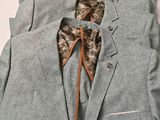 a suit with a tie and a bow tie on a mannequin mannequin mannequin mannequin mannequin mannequin mann