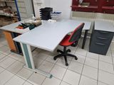 a white table with a red chair in a room