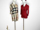 two mannequins dressed in red and black standing next to each other
