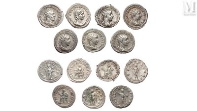 a close up of a bunch of silver coins on a white surface