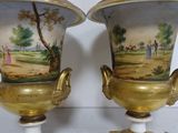 two vases that have been painted with a landscape on them