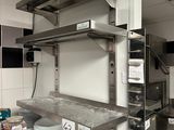 an image of a commercial kitchen with stainless steel shelvings