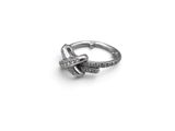 a close up of a silver ring with diamonds on a white background
