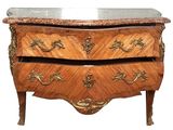 a small chest of drawers with a marble top