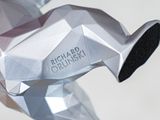 a close up of a silver origami sculpture of a horse