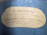 a blue vase with a label on it that says g grandini