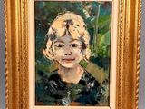 an oil painting of a woman with blonde hair in a gold frame
