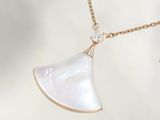 necklace with white mother of pearl pendant and gold chain