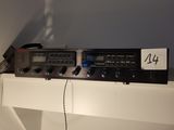 a picture of a radio on a shelf with a lot of wires