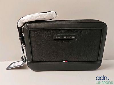 a small black bag that is sitting on a table