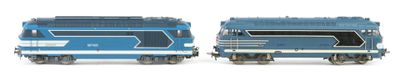 two toy trains on a white surface one is blue and the other is silver