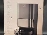 the box of the coffee maker is open and ready to be used